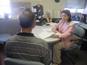 File:A Probation and Parole Officer with the Missouri Department of Corrections interviews a drug-related offense probationer.jpg