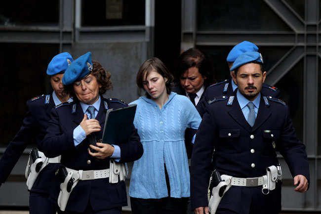 Amanda Knox, led by police officers after the first session of her appeal on November 24, 2010 in Perugia, Italy.
