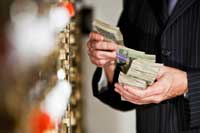 Bank Customer gets cash from safe deposit box